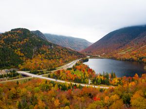 Franconia Notch in autumn. View from Artist's Bluff looking across Echo Lake down the Notch. Cannon Mountain and Mount Lafayette on the right and left.