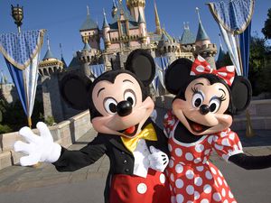 Minnie and Mickey Mouse at the Disneyland castle