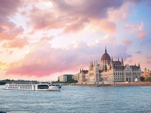 Exterior shot of Uniworld's S.S. Maria Theresa in Budapest on the Danbue River at sunset