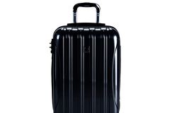 DELSEY black luggage on white background