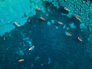High angle view of fishing boats floating on the Caribbean Sea, Anse Dufour, Martinique
