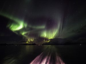 Aurora display in the wake of the Hurtigruten cruise ship, Norway.