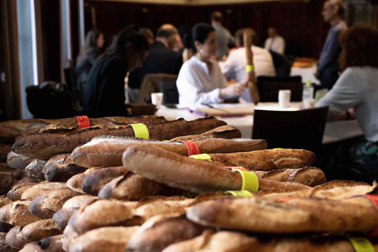 A photograph taken on May 10, 2023 shows baguettes in front of members of the jury during the annual "Grand prix de la baguette de tradition franÃÂ§aise de la Ville de Paris, aka the best baguette in Paris competition, in Paris. 