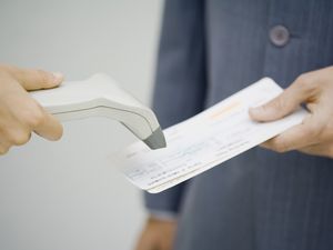 Passenger having their boarding pass scanned
