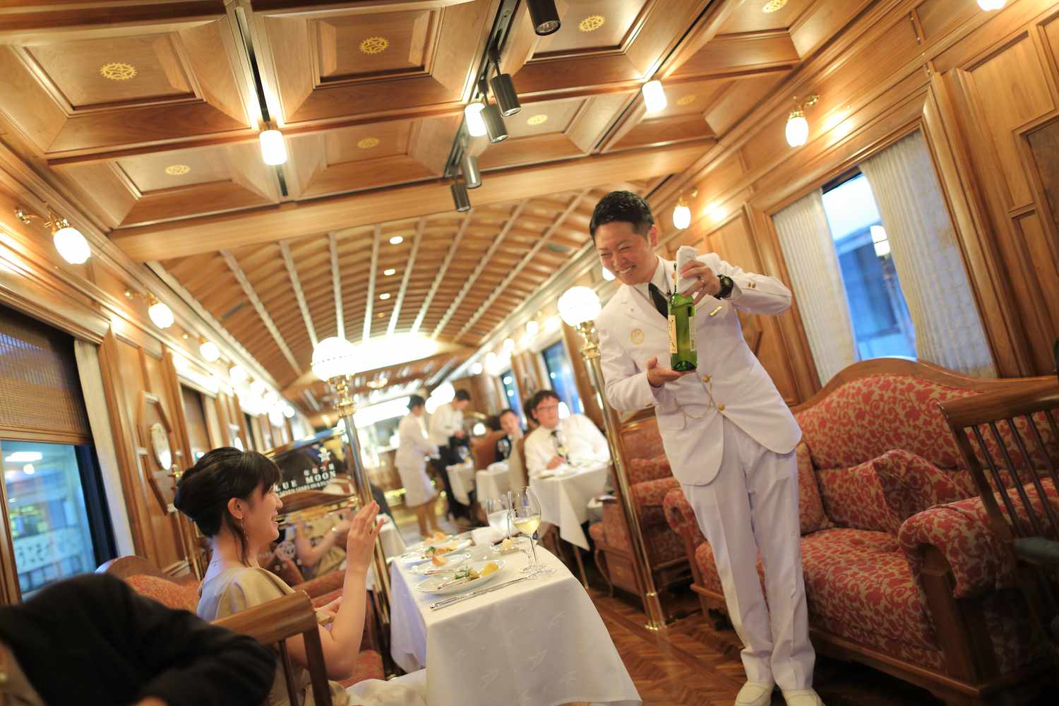 A woman being served on the Seven Stars train