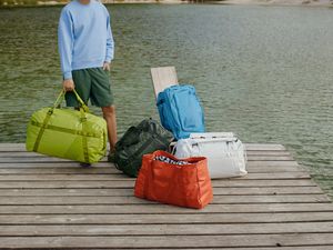 Collection of new Away bags on a dock