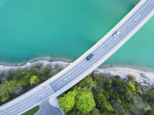 aerial view of cars driving over Lake Sylvenstein, Bavaria, Germany