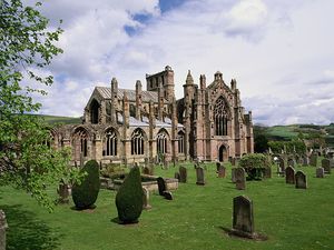 a small cemetery beside the stone ruins of Melrose Abbey