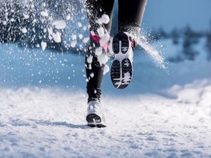 Close-up of person running during winter training outside