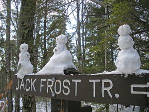 tiny snowmen on a trail sign in Massachusetts