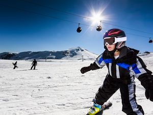 Little Girl Skiing on a Bright Sunshine Day