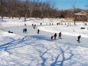 People skating at Lafontaine Park natural ice rink