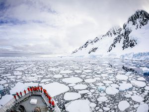 A cruise ship passes Booth Island in Antarctica