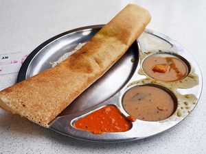 Close-Up Of Dosa Served In Plate On Table