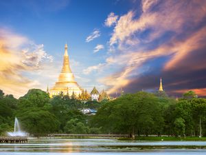 Shwedagon pagoda scenic view from the Bogyoke park in the center of Yangon Myanmar with wonderful sky in sunset time, twilight