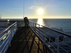 People on cruise ship watching sunset