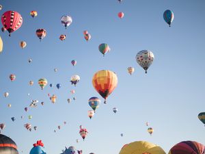 Low Angle View of Hot Air Balloons In Clear Sky