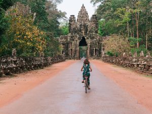 Biking tourist in Angkor park, Cambodia