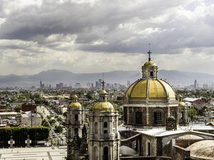 Guadalupe Basilica church and Mexico City skyline