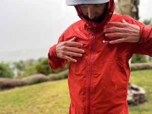 Person wearing the Montane Spine Jacket in the rain