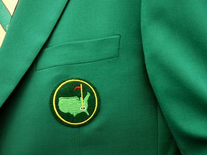 The Augusta National logo on the green jacket that signifies membership in the club.