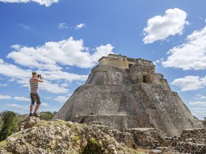 Mexico, Yucatan, Uxmal, Tourist visiting Mayan ruins