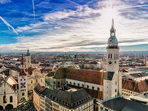 Cityscape of Munich with Alps in the background