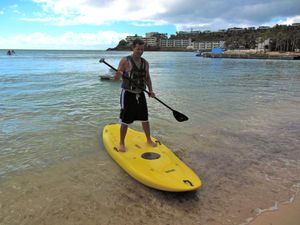 Gliding back to shore while standup paddleboarding in Bolongo Bay