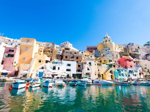 Colorful houses and boats at Procida Island, Bay of Naples, Italy