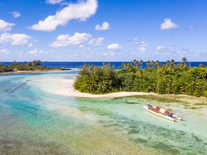 Sailboat in the idyllic Muri lagoon in rarotonga in the Cook islands in Polynesia south Pacific