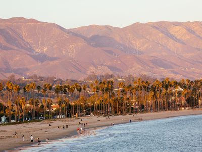Santa Barbara beach surrounded by palm trees and mountains, California, USA
