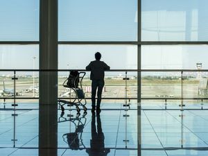 Silhouette of traveller at Barcelona Airport; Barcelona, Spain