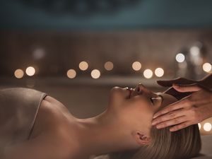 Person enjoying facial massage at Mandarin Oriental, Atlanta, GA