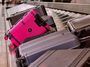 The bright pink Un-carrier On from T-Mobile with other luggage