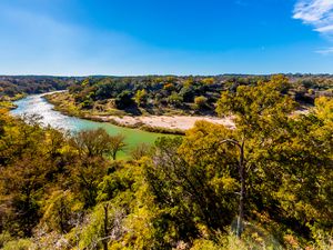 View of the Texas Pedernales River from a High Bluff, with Fall Foliage.