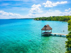 Thatch cabin at the paradise white sand beach of Bacalar, Mexico