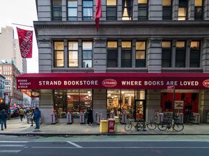picture of the signature red awning and flag of Strand Bookstore in New york city