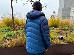Person wearing the Rab Neutrino Pro coat outside