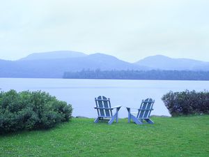 Two Adirondack Chairs Beside Blue Mountain Lake