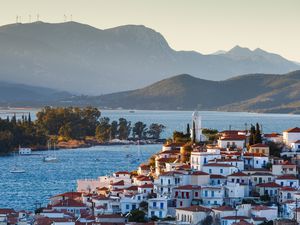View of Poros island and mountains of Peloponnese peninsula in Greece.