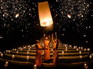 Monks release lanterns during Yi Peng, a fall festival in Asia
